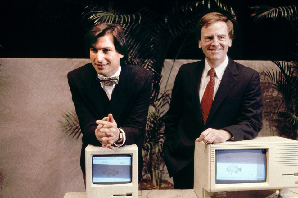 Apple CEO Steven P. Jobs, left and President John Sculley present the new Macintosh Desktop Computer in January 1984 at a shareholder meeting in Cupertino, California, USA. (AP Photo)
